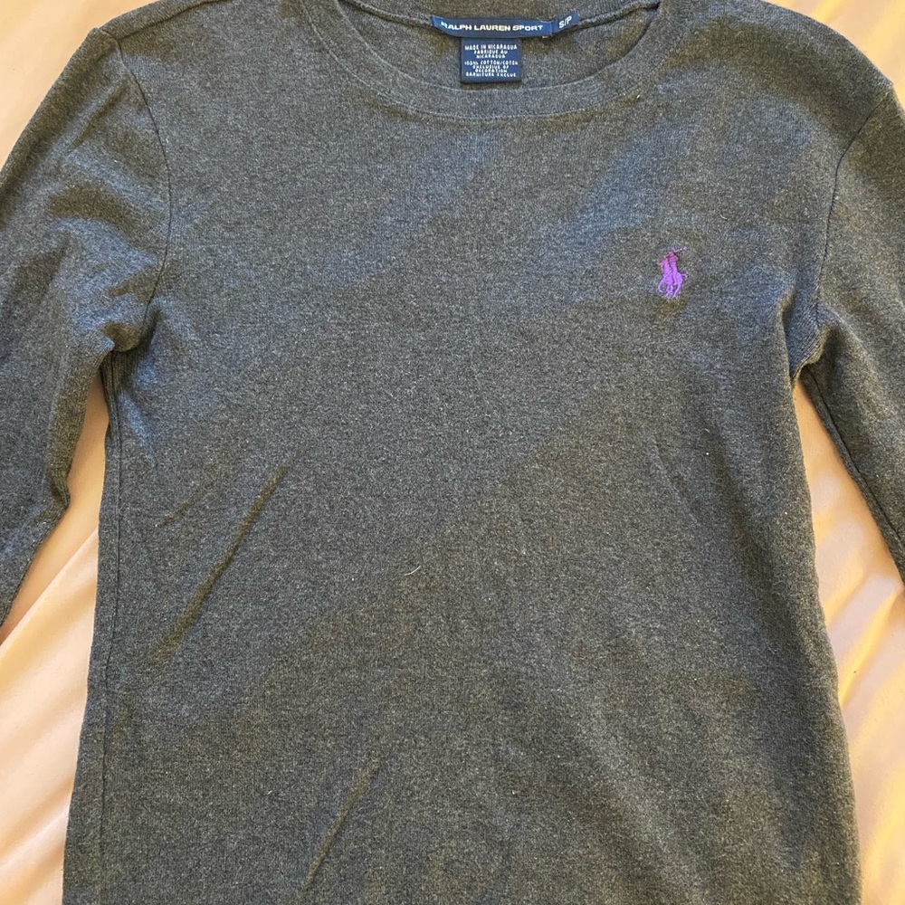 Dark grey long sleeve polo sweater, with purple logo. In great condition